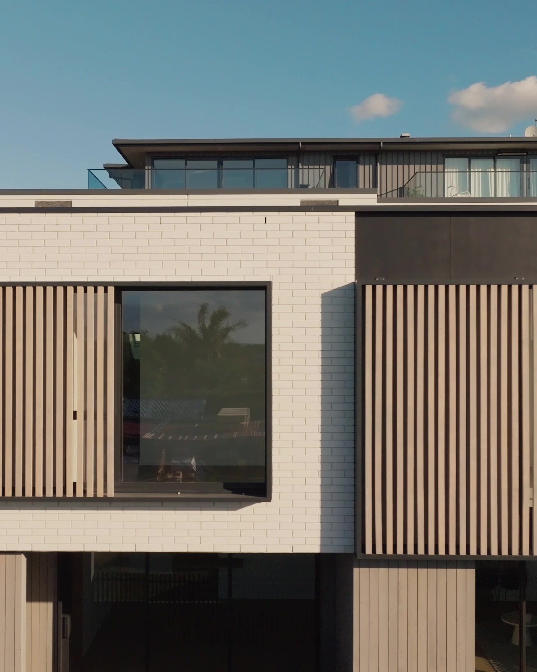 Cedar batten and dark cladding detail at 13 Walmer Road